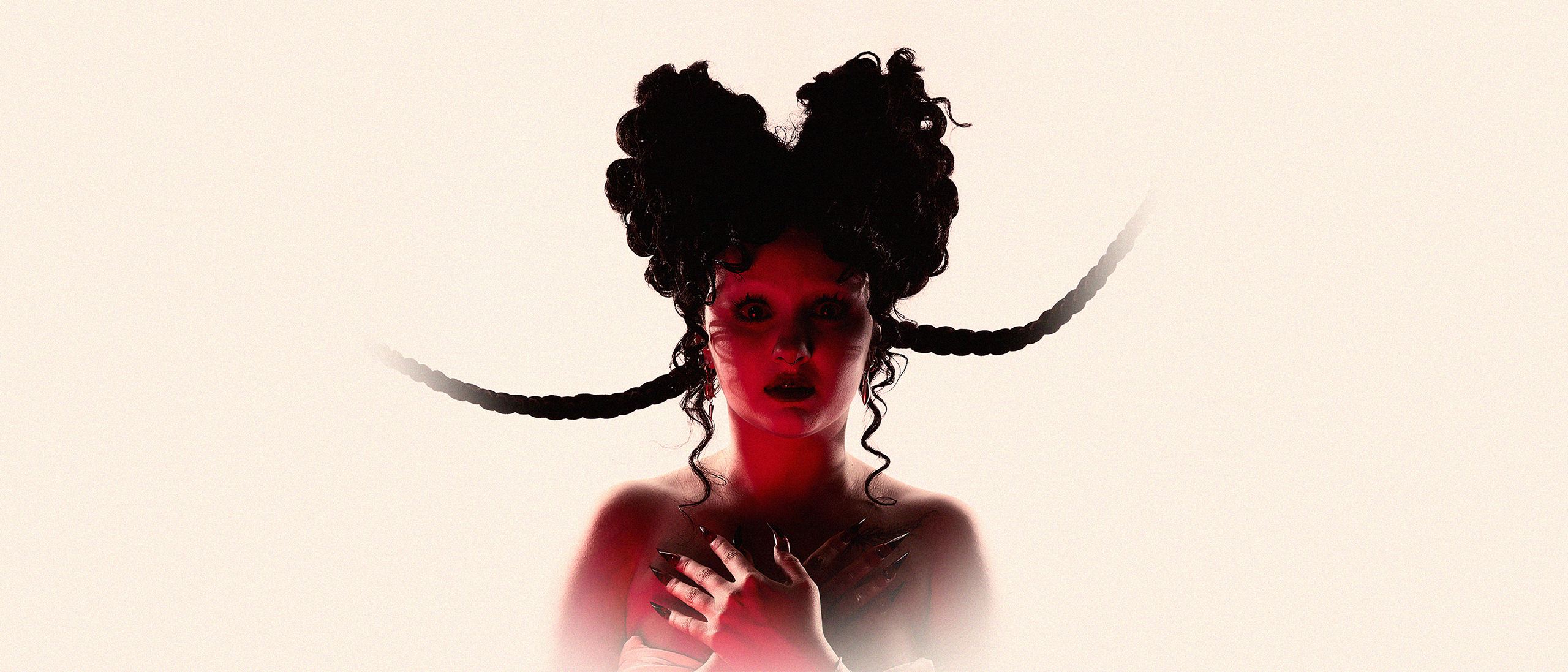 Valencia Grace in red light with braided hair and long nails, for the PARASITE EP